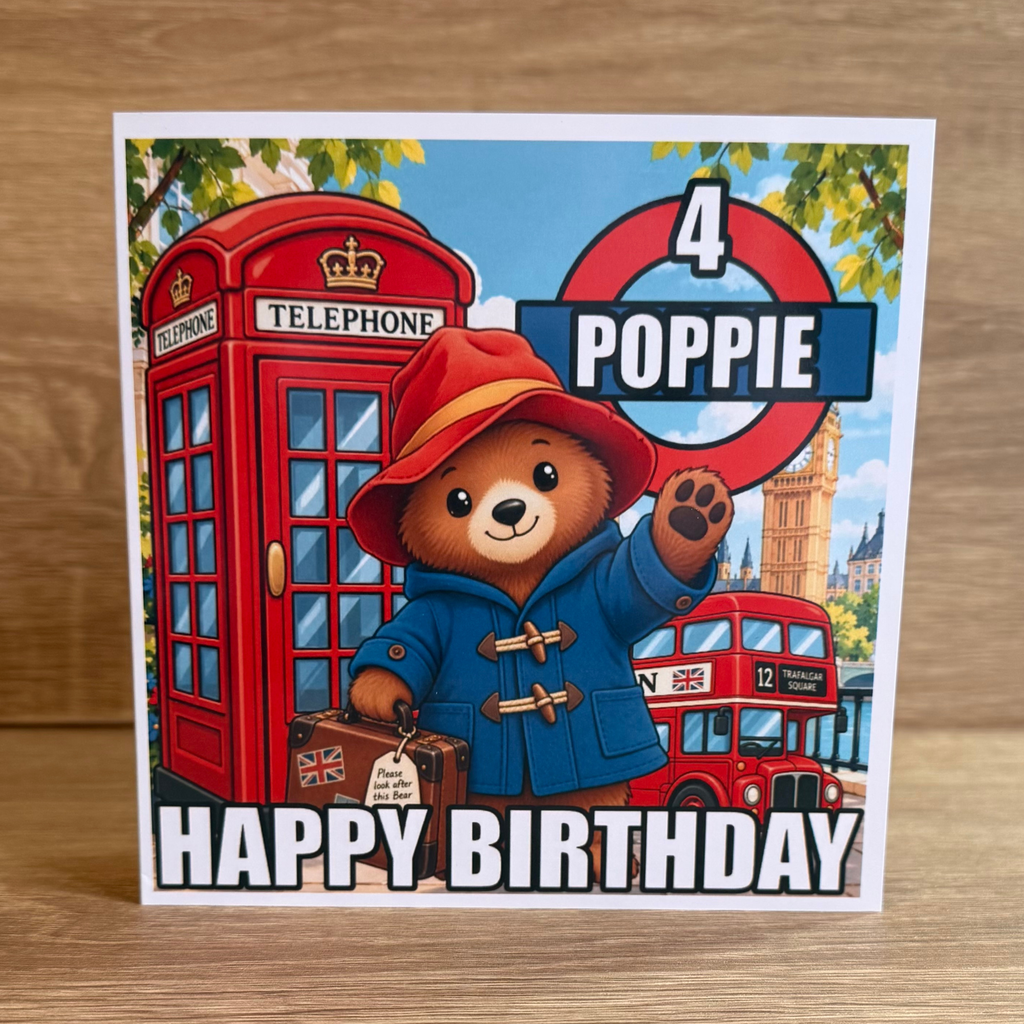 Paddington Bear personalised 6x6 birthday card with name Poppie age 4 and colourful London bus and telephone box design